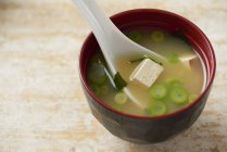 Closeup view of Miso soup in traditional Japanese bowl — Stock Photo