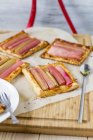 Closeup view of rhubarb puff pastries on paper — Stock Photo