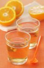 Glasses of orange cordial — Stock Photo