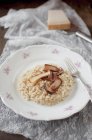 Pearl barley risotto rice mushrooms — Stock Photo