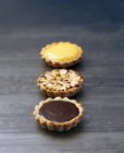 Tartlets with chocolate, lemon and apple — Stock Photo