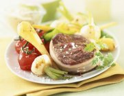 Tournedos with new vegetables — Stock Photo