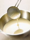 Ladle of pancake batter — Stock Photo