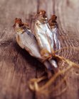 Smoked sprats tied with twine — Stock Photo