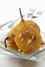 Closeup view of roasted pear with dried fruit and spices — Stock Photo
