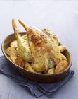 Roasted chicken with parsley and potatoes — Stock Photo