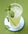Mint-flavored lemonade in glass — Stock Photo