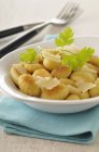 Potato gnocchi pasta with cheese shavings — Stock Photo