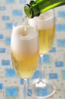 Elegant glasses of cold champagne — Stock Photo