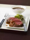 Sliced beef fillet with Prigueux sauce — Stock Photo