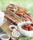 Raw brochettes and mini sausages — Stock Photo