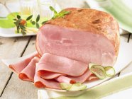 Smoked ham with slices — Stock Photo