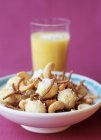 Closeup view of muesli with bananas and cashew nuts — Stock Photo