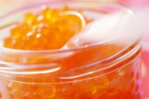 Closeup view of trout fish roe in glass jar — Stock Photo