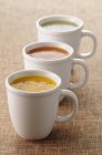 Vegetable creamed soups in cups — Stock Photo