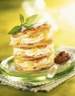 Mousse and peach in flaky pastry — Stock Photo