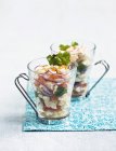 Fish Cviche in cups over towel — Stock Photo