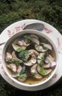 Top view of clear herbal soup with Porcini mushrooms — Stock Photo