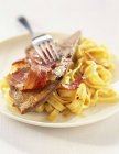 Bacon and tagliatelle pasta — Stock Photo