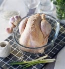 Raw chicken in baking pan — Stock Photo