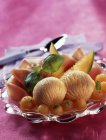 Melon sorbet and parma ham — Stock Photo