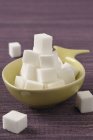 Bowl of white sugar lumps — Stock Photo