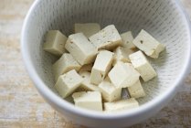 Closeup view of diced Tofu cheese in a dish — Stock Photo