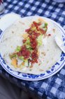 Rrito on camping table — Stock Photo
