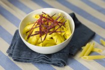 Penne pasta with beetroot and saffron — Stock Photo