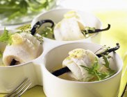 Closeup view of fish rolls with herbs and butter — Stock Photo