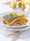Piece of salmon with petoncle scallops — Stock Photo
