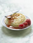 Closeup view of Crumpet with raspberry syrup and berries — Stock Photo