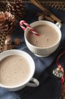 Mugs of frothy hot chocolate — Stock Photo