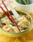 Soup with pork dim sums and prawns — Stock Photo