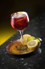 Sangria in a glass with citrus fruits — Stock Photo
