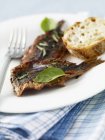 Escabche sardines on plate — Stock Photo