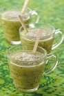 Closeup view of kiwi, lemon, ginger and cinnamon soup in glass cups — Stock Photo