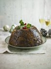 Christmas Pudding with holly — Stock Photo