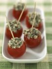Cherry tomatoes with anchovies — Stock Photo
