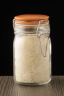Jar of white uncooked rice — Stock Photo