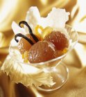 Candied chestnuts in glass over golden towel — Stock Photo