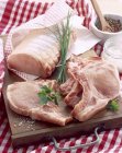Uncooked pork chops and joint for roasting — Stock Photo