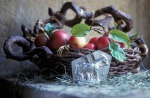 Apples in wicker basket — Stock Photo