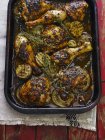 Tray of jerk chicken thighs and legs — Stock Photo