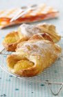 Apricot croissants topped with sugar powder — Stock Photo
