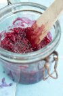Closeup view of preserved lingonberries in a jar — Stock Photo