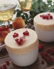 Closeup view of iced peach souffle with red currants — Stock Photo