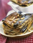 Piece of eggplant and pine nuts lasagne — Stock Photo