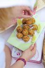 Fish balls with celery, onion and sesame for a beach picnic — Stock Photo