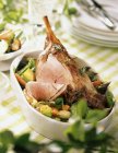 Leg of lamb with spring vegetables — Stock Photo
